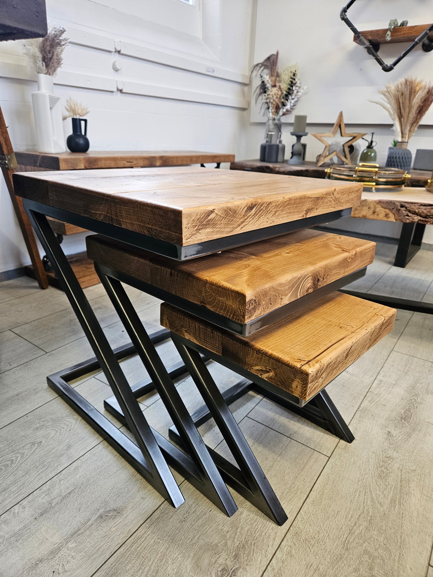 Wooden table with black metal legs on a wooden floor