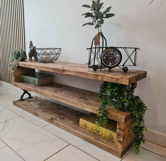Rustic TV stand styled with décor and books