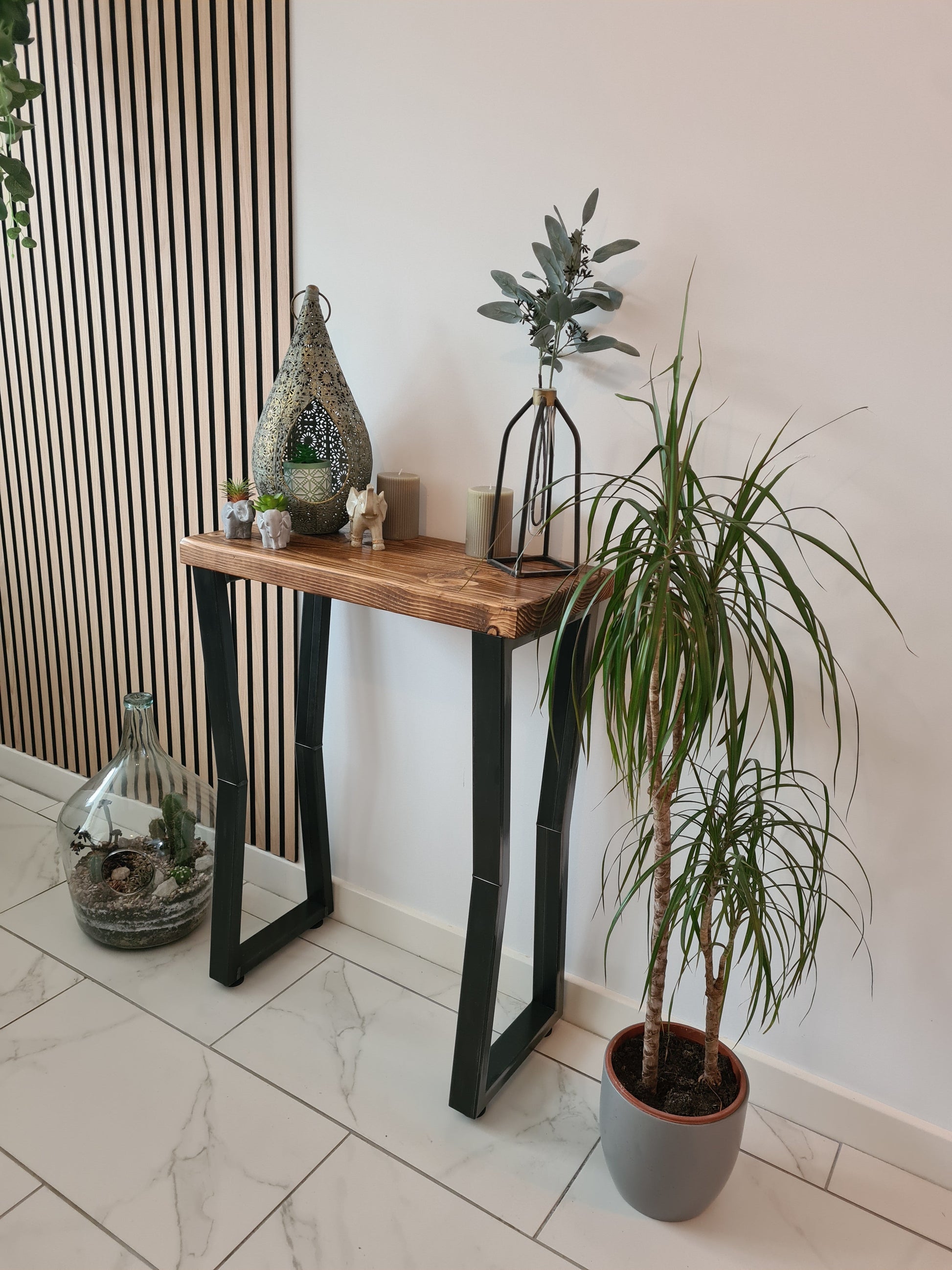 Solid wood and metal console table styled with décor