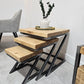 Two wooden stools with black metal frames on a light gray floor.