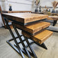Wooden table with black metal legs on a wooden floor