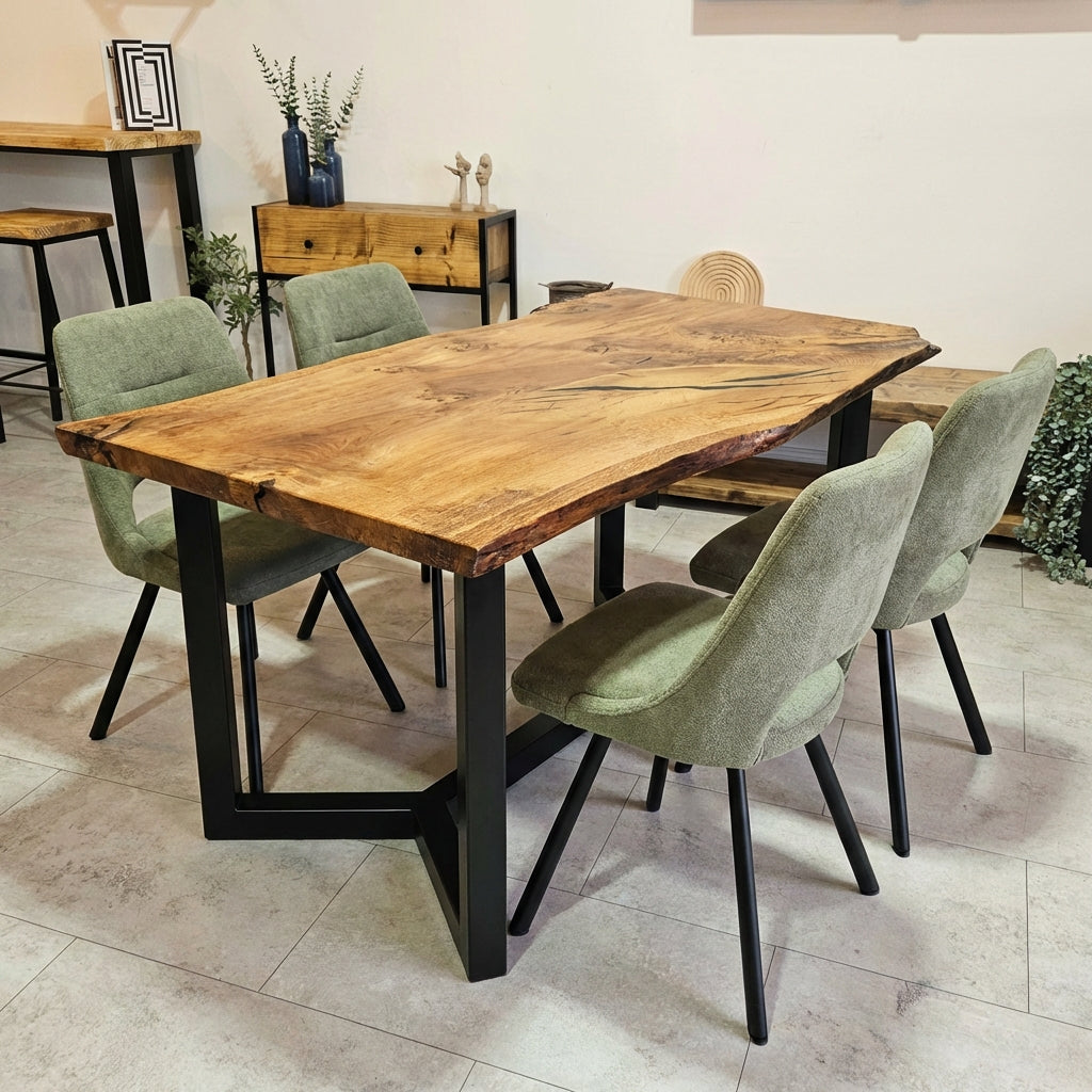 Dining table with green chairs in a room setting